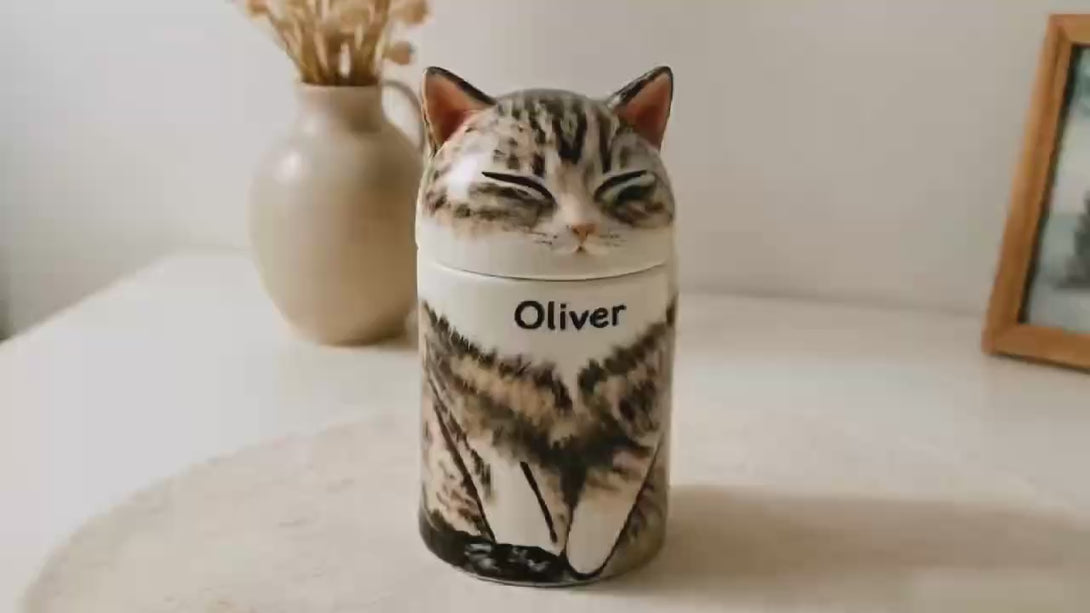 Video of a personalized cat cremation urn showing handmade ceramic portrait details